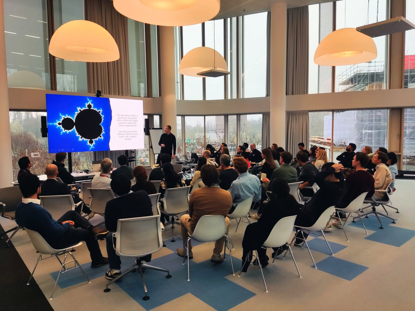 Imre V&eacute;gh presenting to a full room during an in-company training session