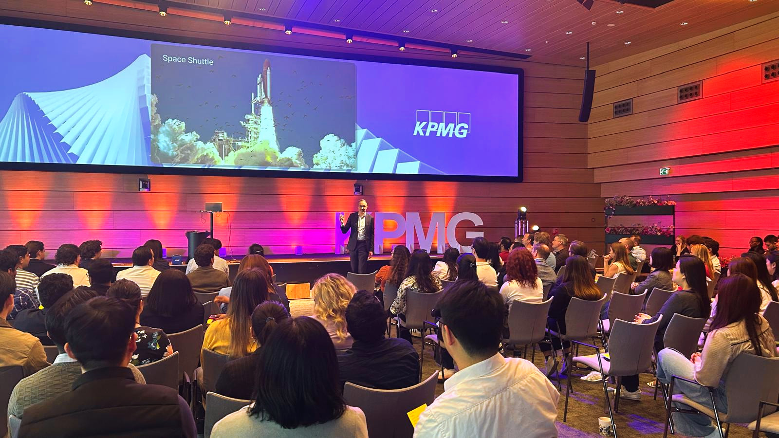A full auditorium at KPMG during Imre Végh’s keynote on psychological safety